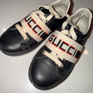 Gucci Kids Black Leather Sneakers with Ivory Logo Strap and Red Accent
